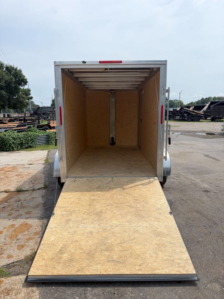 Alcom 6x12 enclosed trailer with spring assisted rear ramp open
