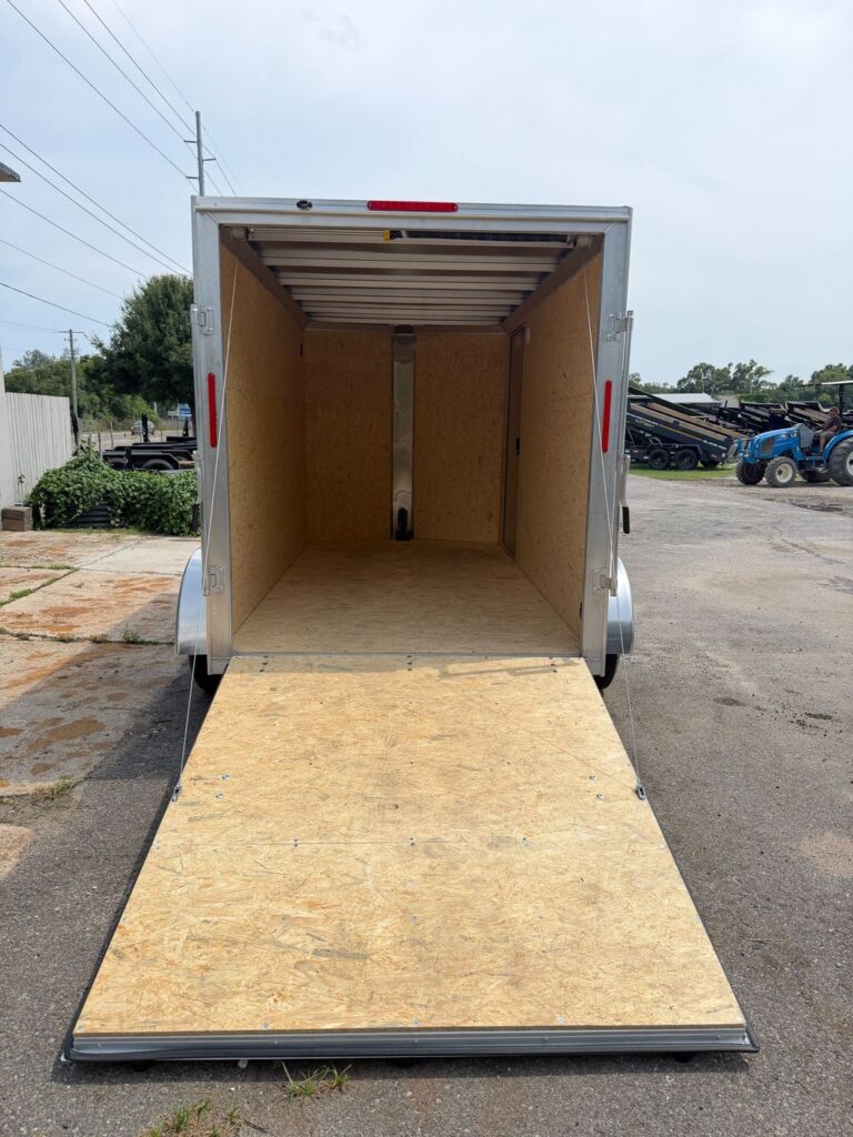 White Alcom 6x12 enclosed cargo trailer rear ramp and cargo space